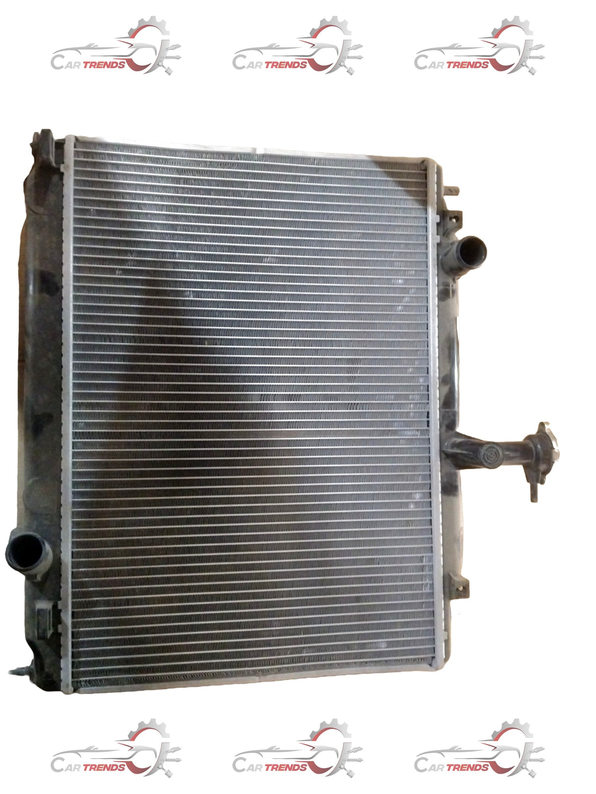 CarTrends Verna old model radiator assembly for petrol engines, spare parts image showing the radiator with mounting brackets.