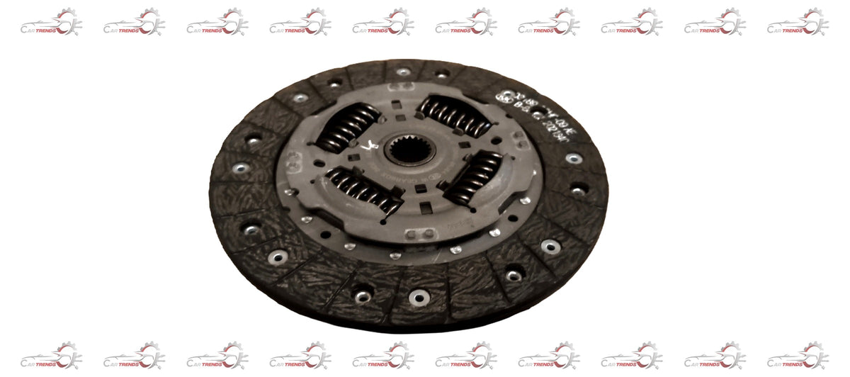 Maruti Suzuki clutch plate for Swift diesel engine, showing the metal friction surface and clutch disc assembly.