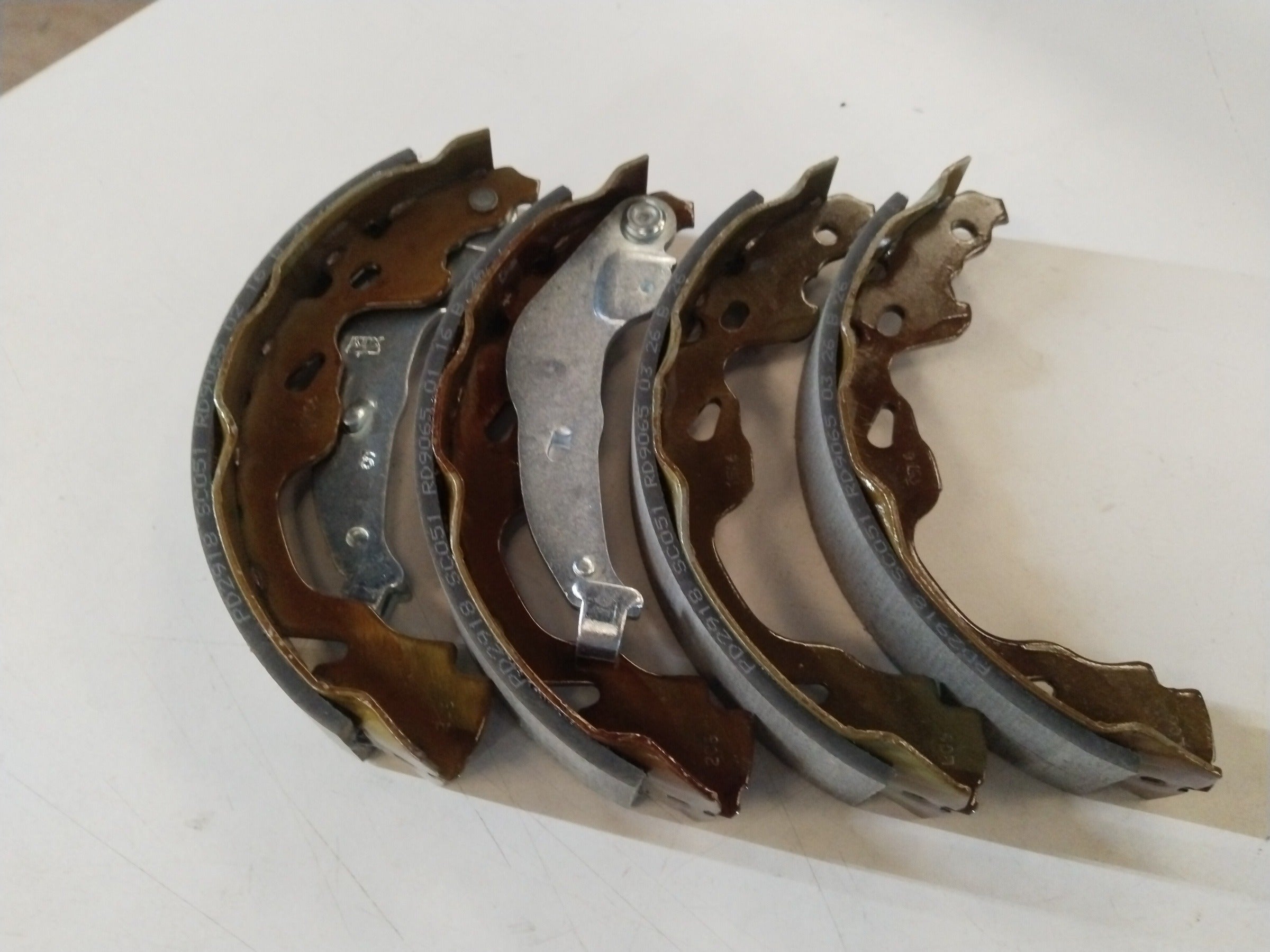 Rear brake shoe for Maruti Swift 1st Gen, Swift Dzire, and Esteem by CarTrends, showing the brake shoe component.