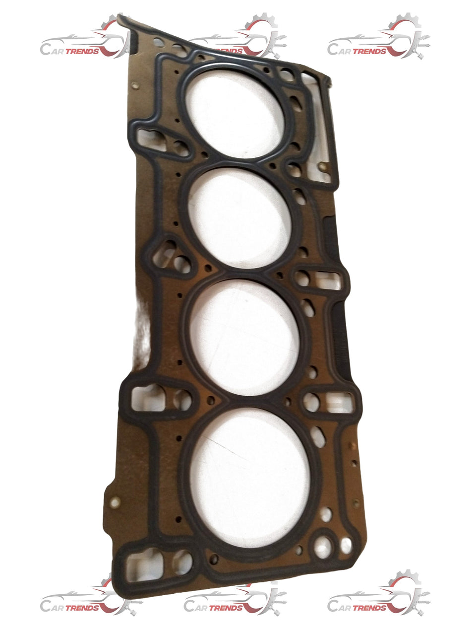 Maruti Suzuki CarTrends cylinder head gasket for Baleno, showing the gasket with detailed metal and rubber components.
