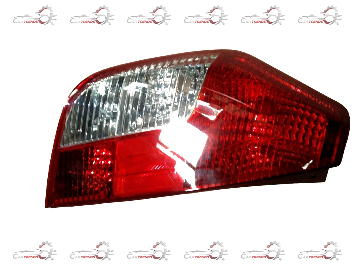 Hyundai I10 tail lamp assembly with clear lens and red and amber sections, designed for rear lighting and signaling.