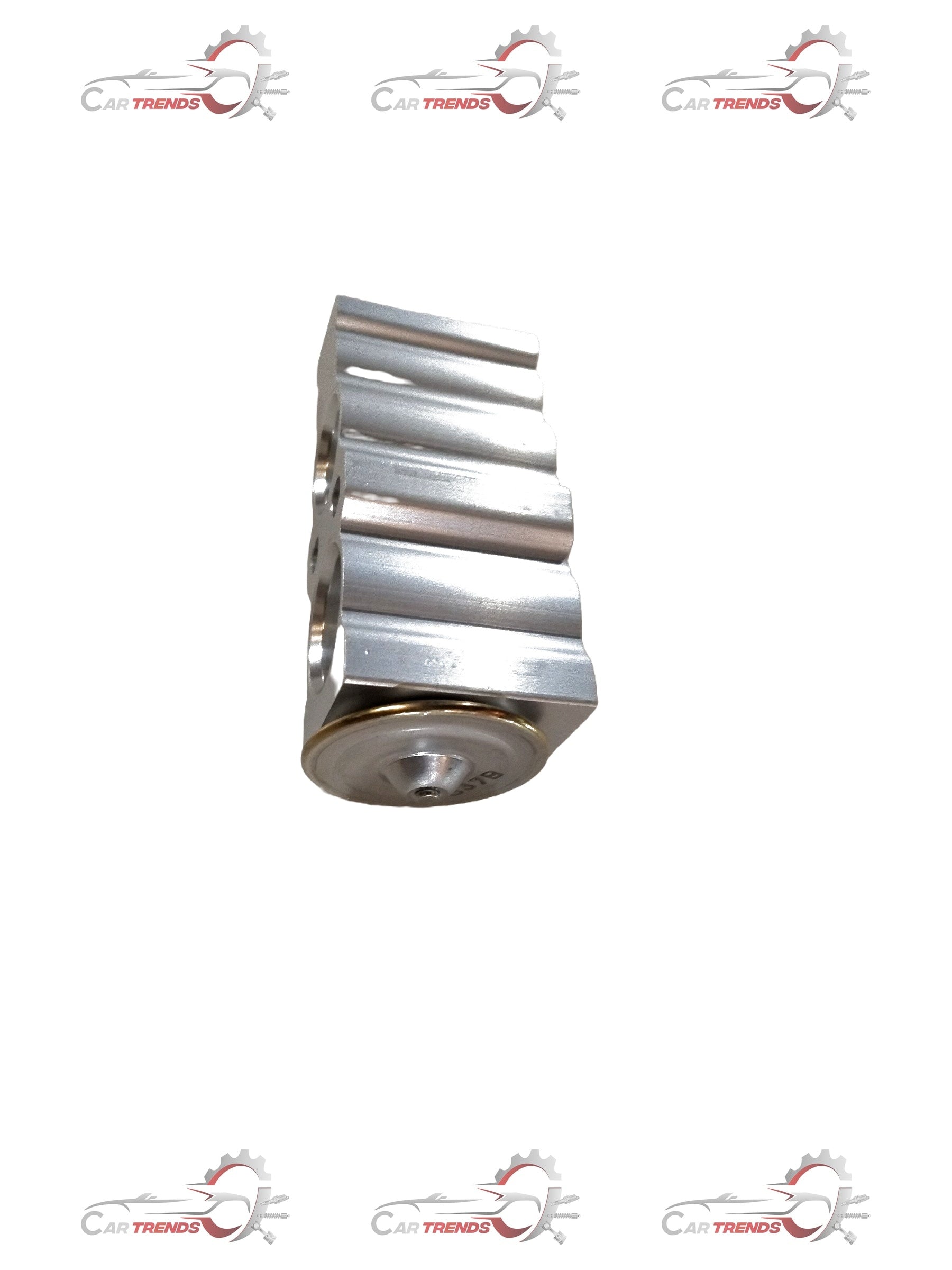 Maruti Suzuki VALE EXPANSION vehicle part with detailed metal components and connectors in a close-up view.