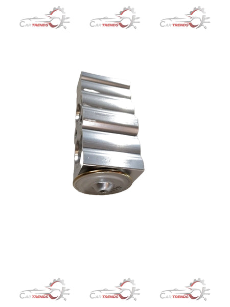 Maruti Suzuki VALE EXPANSION vehicle part with detailed metal components and connectors in a close-up view.
