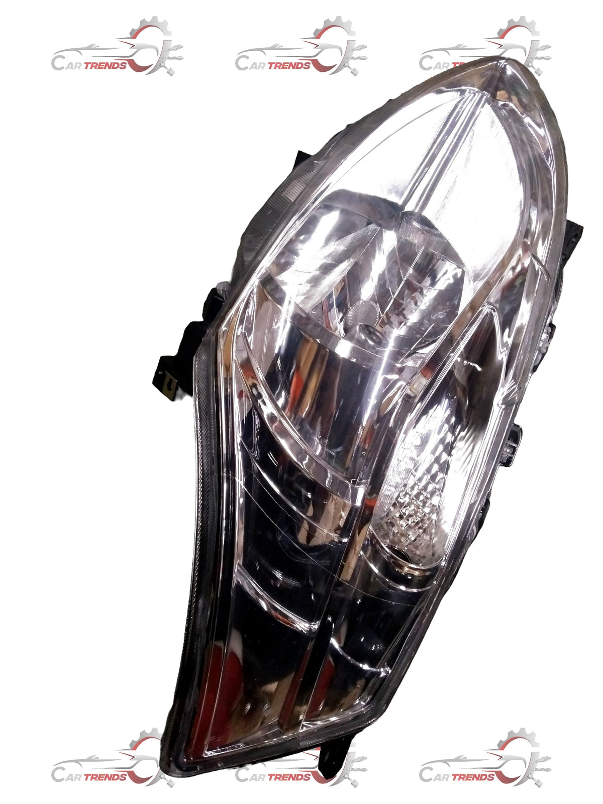 Maruti Ertiga headlight for left side with motor from CarTrends, close-up view showing clear lens and mounting details.