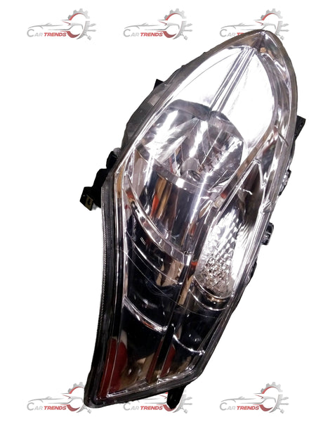 Maruti Ertiga headlight for left side with motor from CarTrends, close-up view showing clear lens and mounting details.
