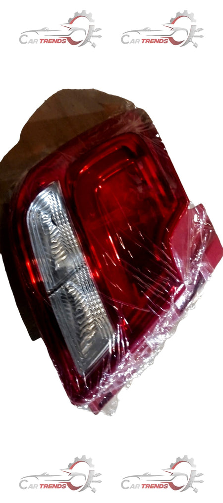Maruti Suzuki rear left lamp unit combination, vehicle lighting assembly with clear lens and mounting brackets.