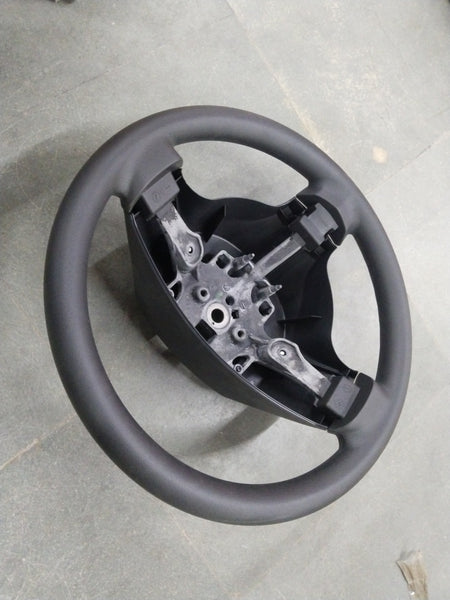 General Motors Chevrolet Enjoy steering wheel assembly with visible spokes and central hub, designed for vehicle steering system.