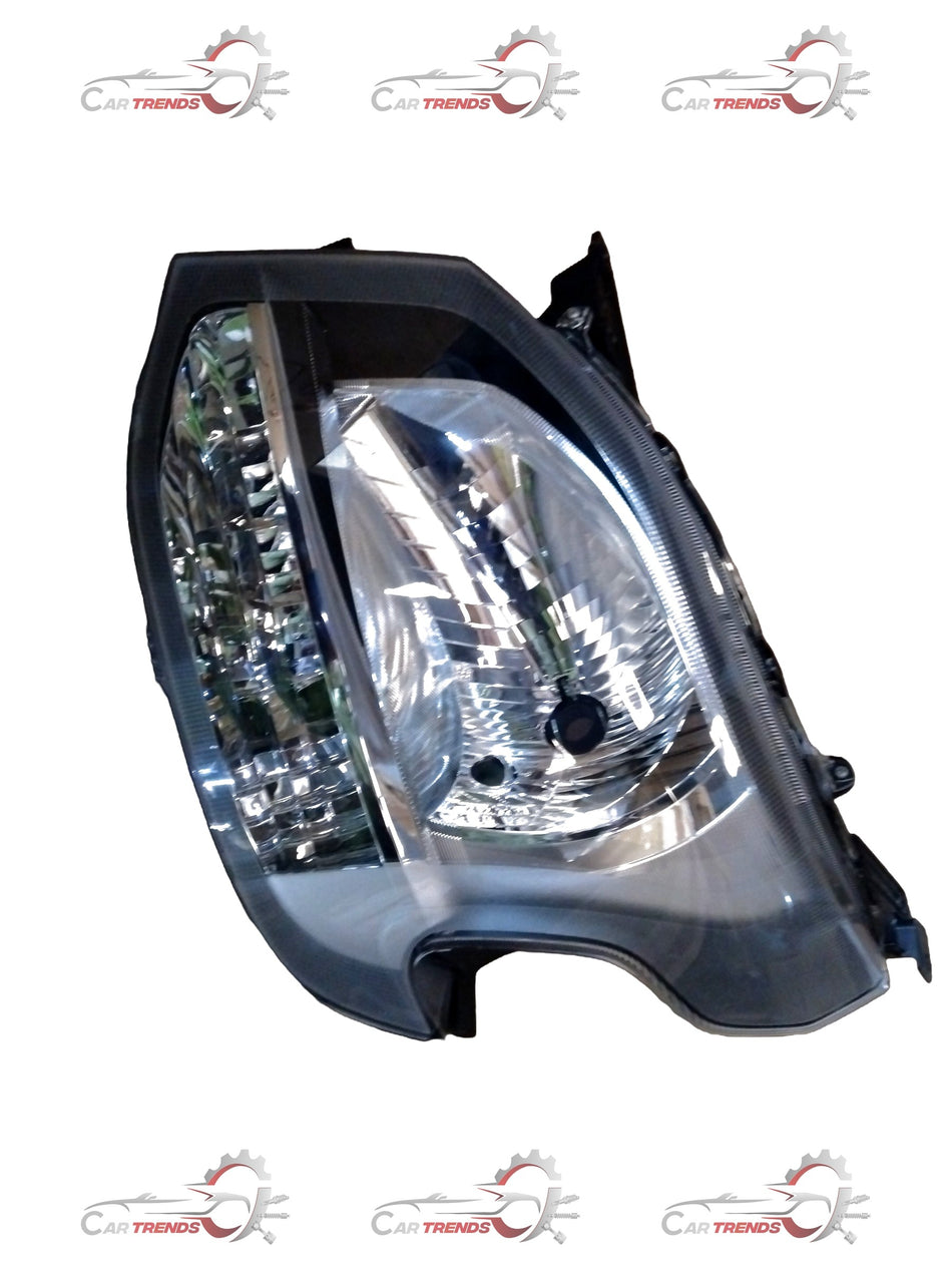 Maruti Suzuki Wagon R head lamp showing the clear lens and housing with the bulb and wiring visible.