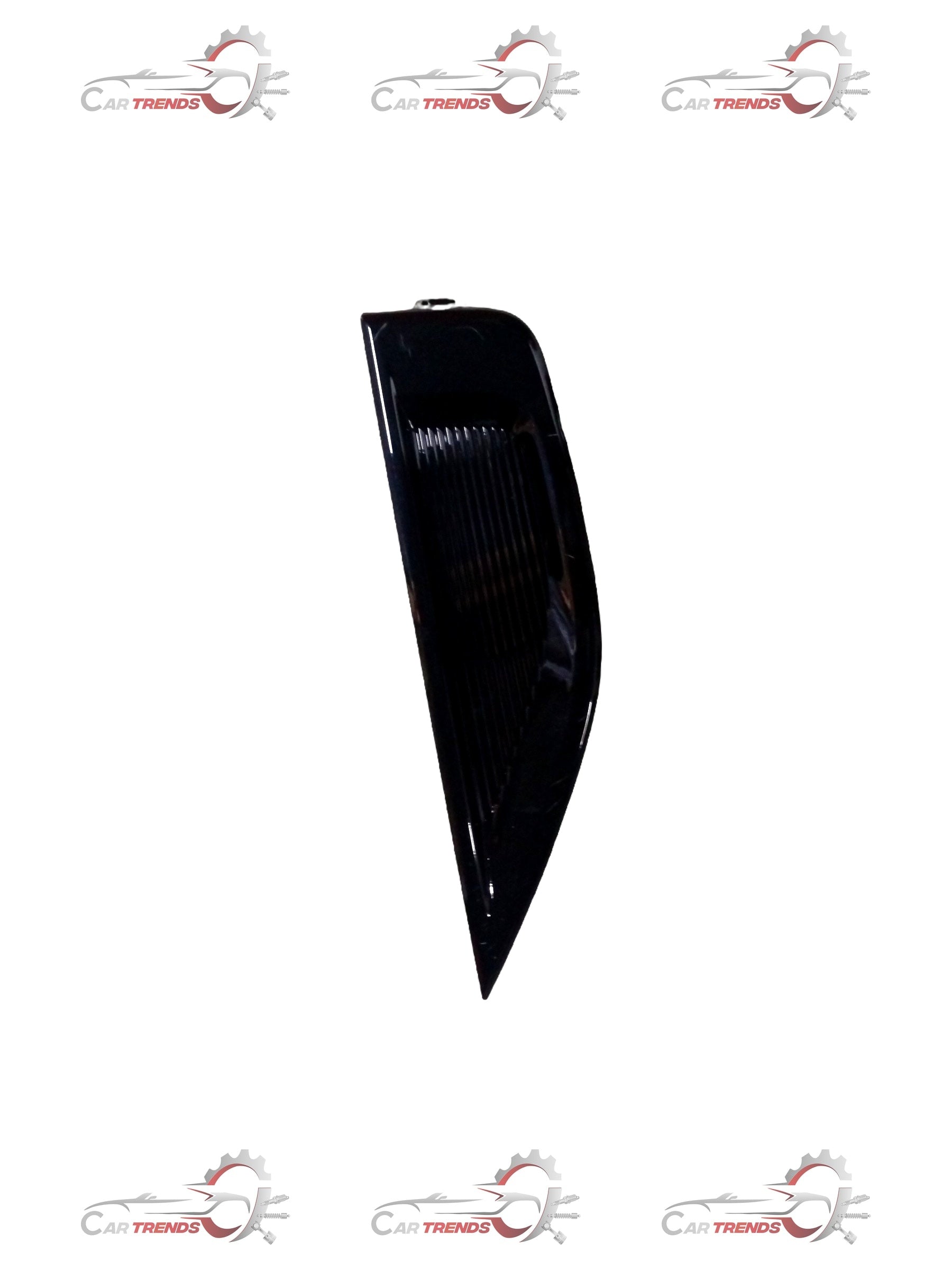 Front headlamp bezel for Maruti Suzuki vehicle, left side, featuring a sleek design and mounting details.