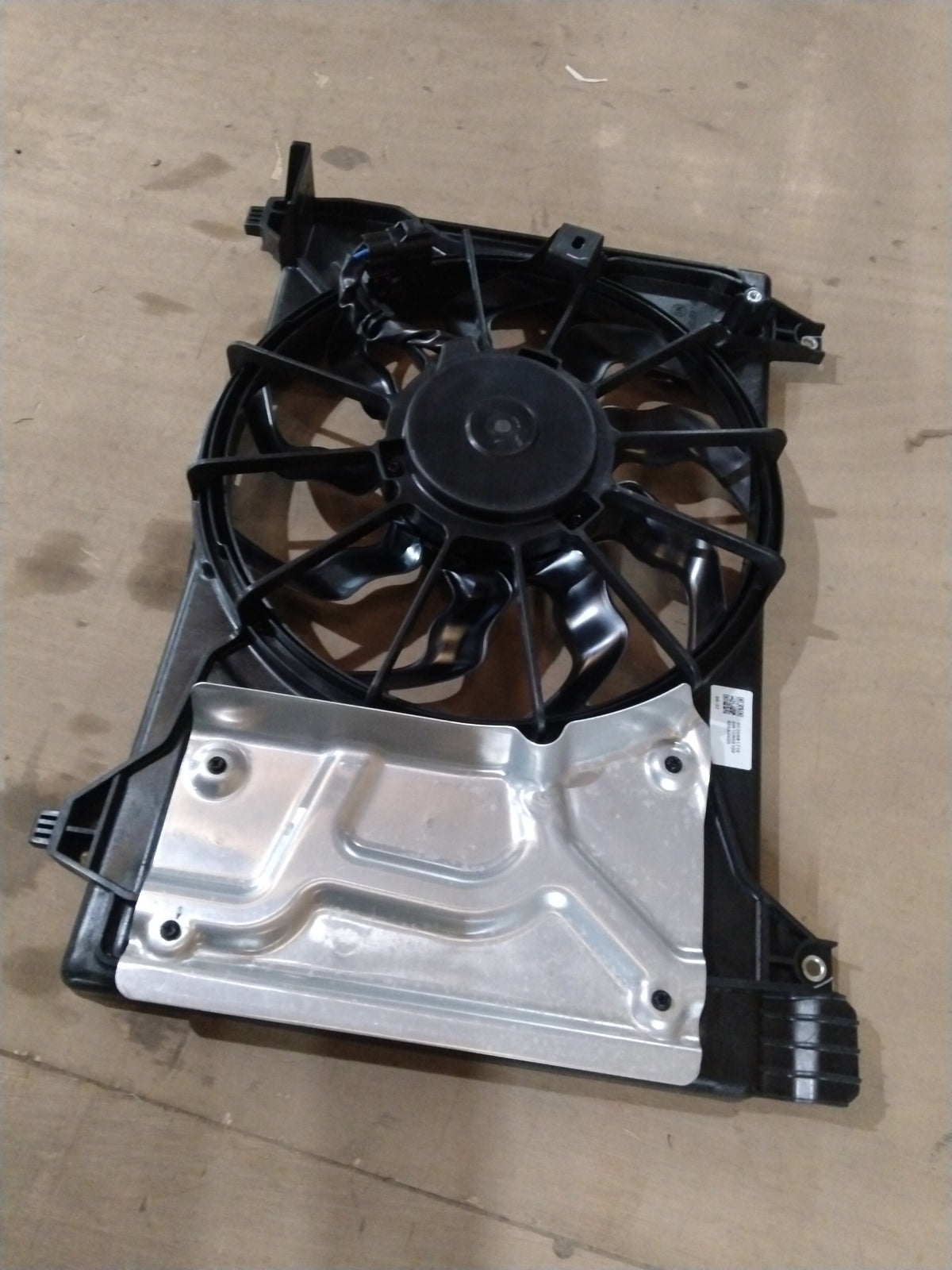 Maruti Suzuki fan assembly cooling for Baleno, showing the fan blade and motor components in a detailed view.