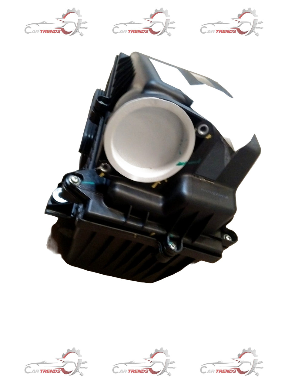 CarTrends Mahindra Bolero air cleaner assembly showing the filter and plastic housing for engine air intake.