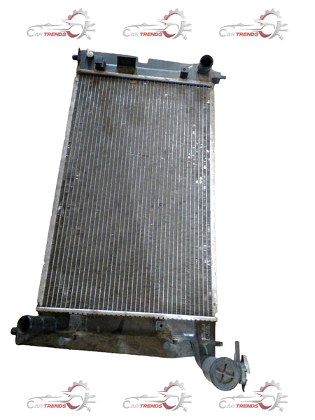 Toyota radiator assembly showing the metal core and mounting components, designed for efficient engine cooling.