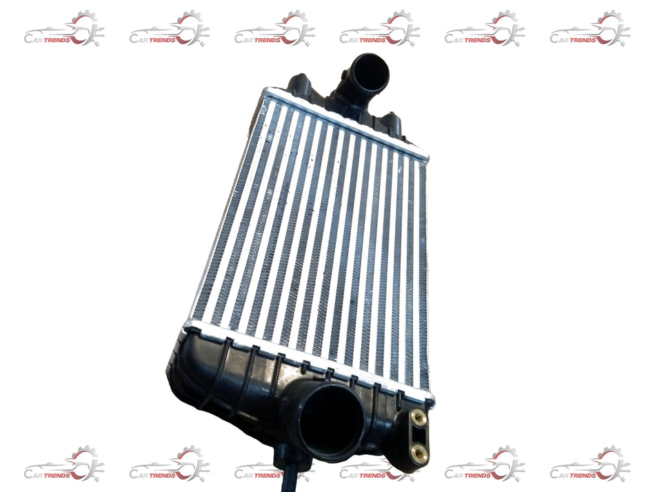 Maruti Suzuki Intercooler for WagonR, showing the black metal component with mounting brackets on a plain background.