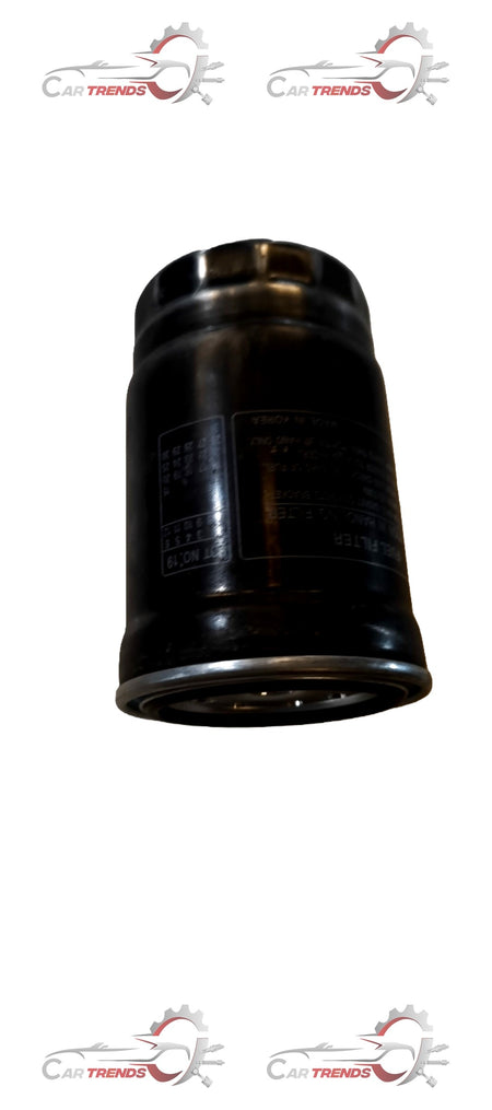 CarTrends fuel filter for Creta, spare parts image showing a clean, new fuel filter component with metal fittings and plastic body.