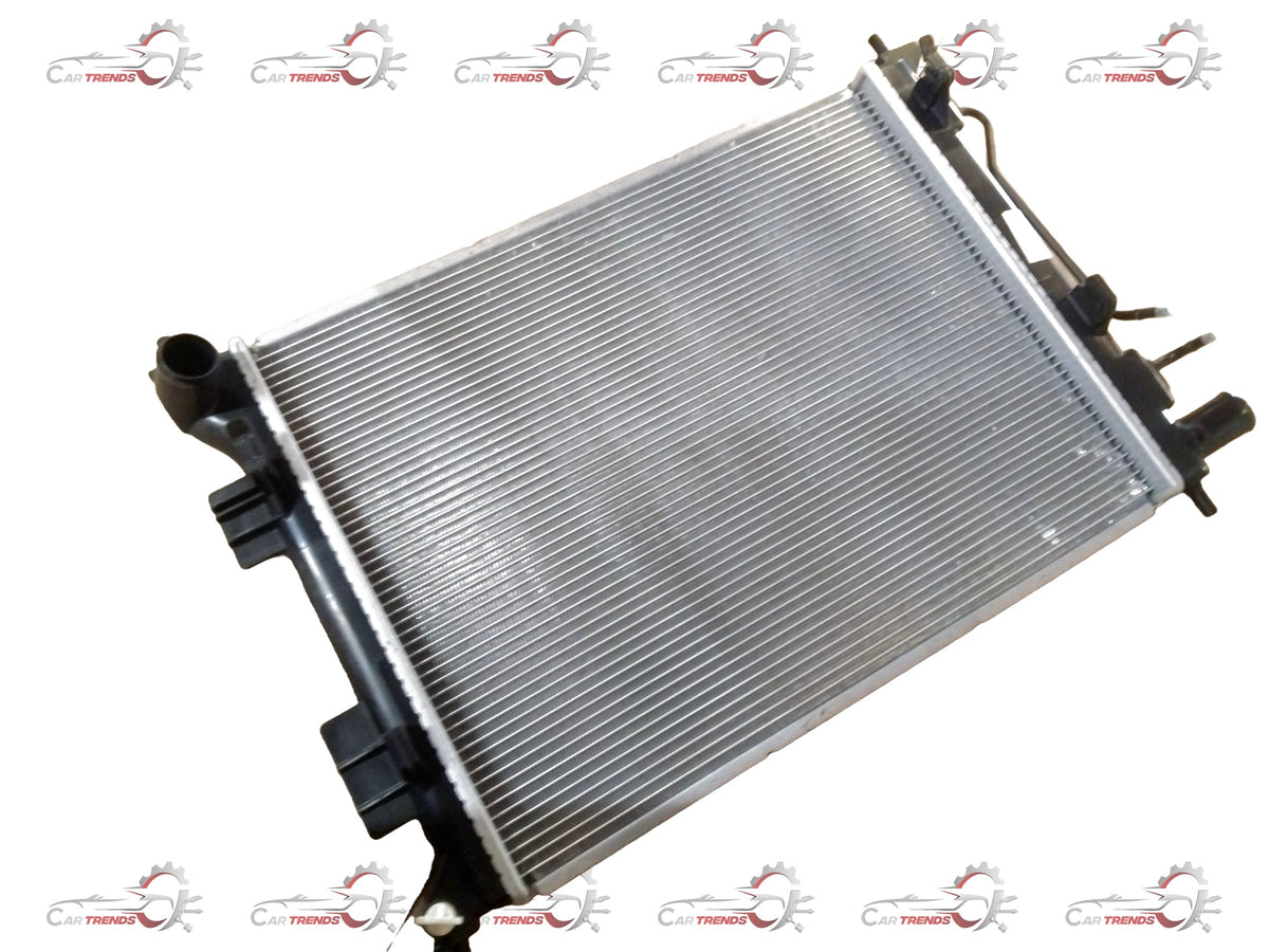 Hyundai Grand i10/Xcent 2013-2019 radiator assembly for petrol engine, showing the radiator core and mounting brackets.