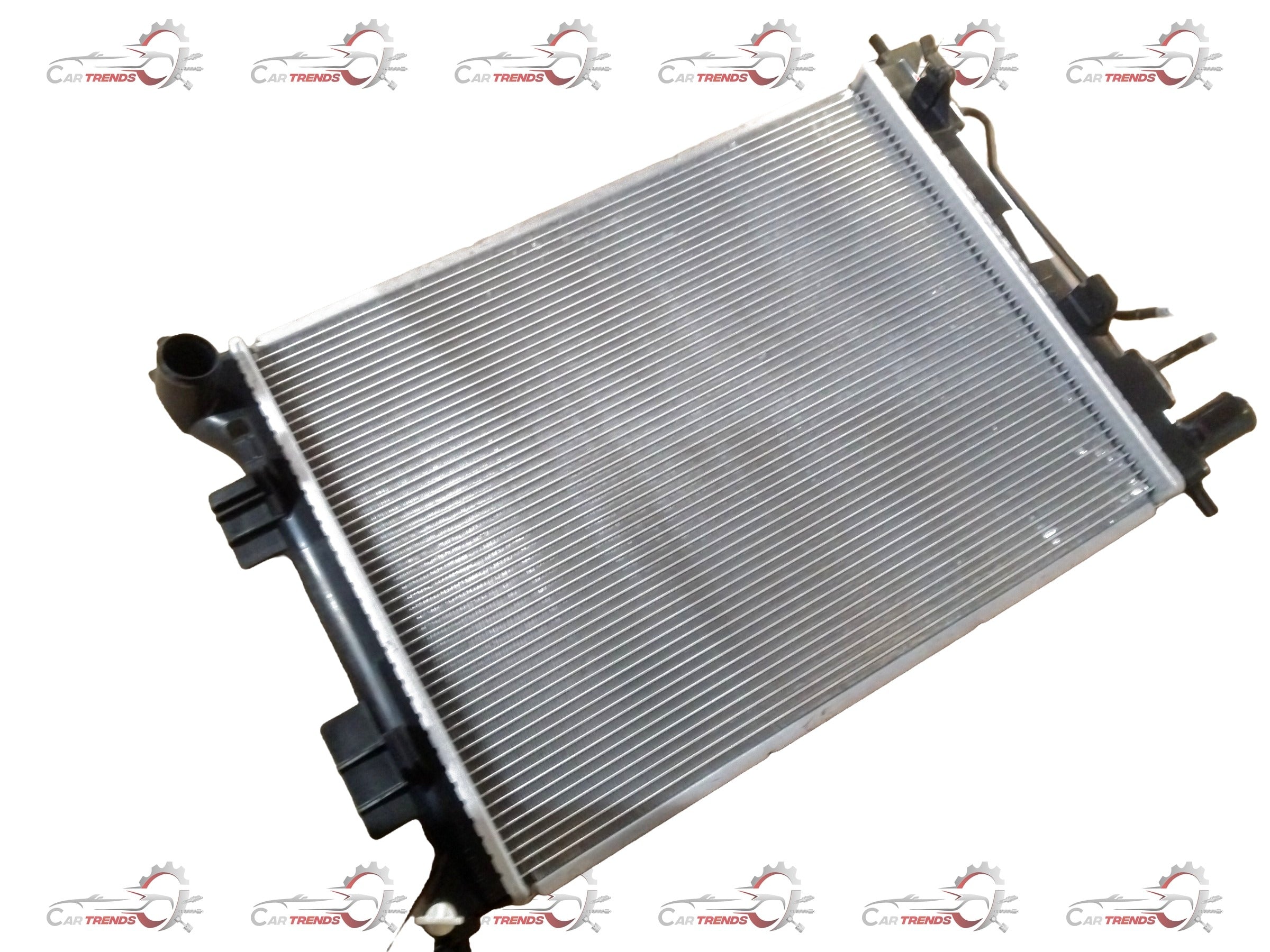 Hyundai Grand i10/Xcent 2013-2019 radiator assembly for petrol engine, showing the radiator core and mounting brackets.