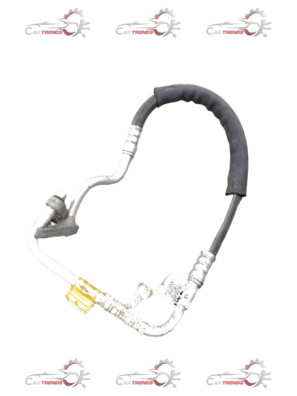 Refrigerant discharge hose assembly for Chevrolet Optra petrol engine, branded General Motors, with metal fittings and flexible hose.