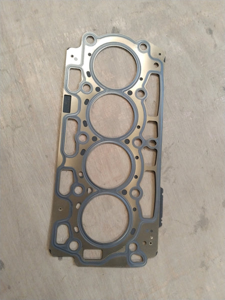 CarTrends Ford cylinder head gasket AV2Z6051C showing the gasket's shape and material for engine sealing.