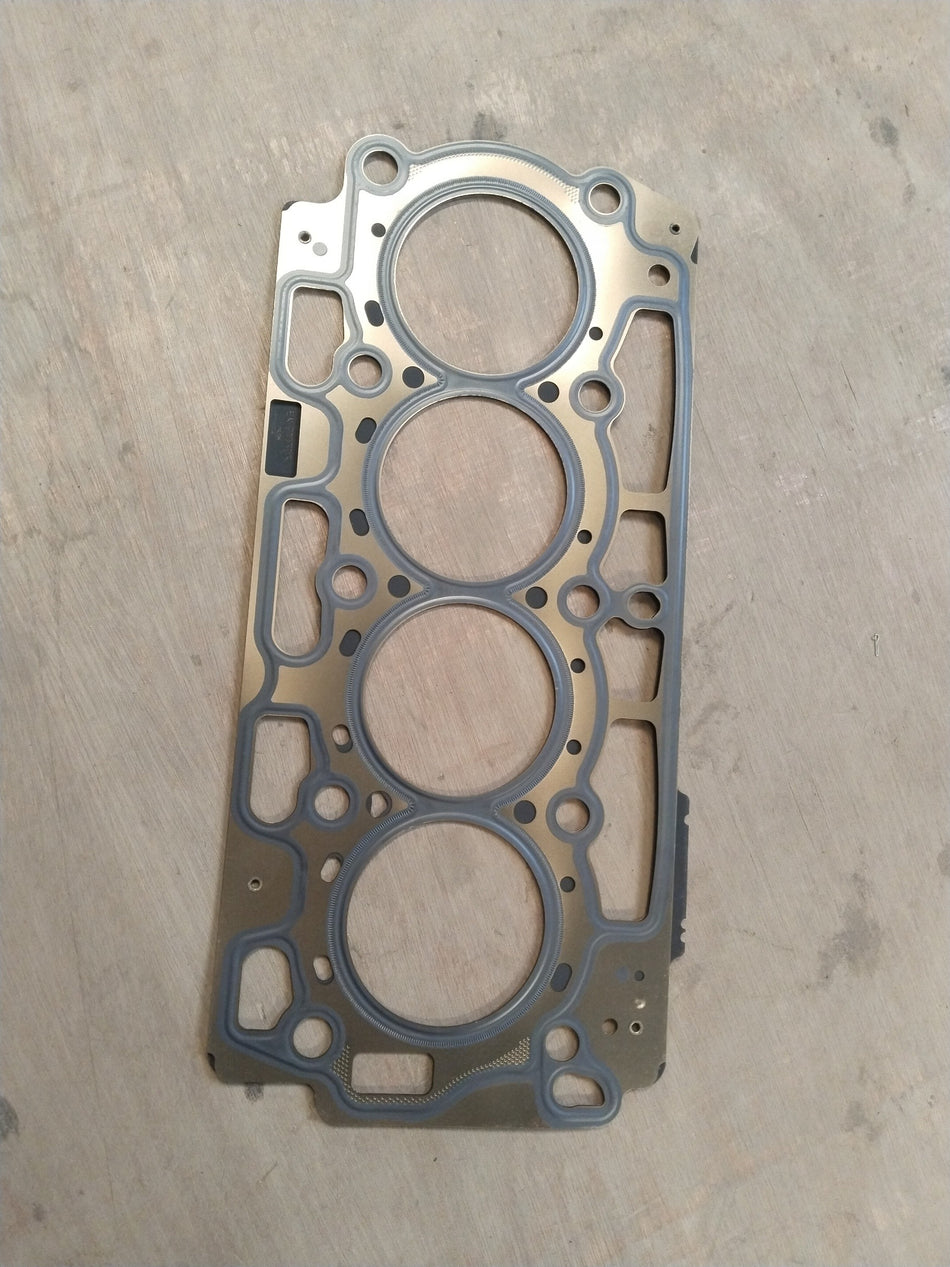 CarTrends Ford cylinder head gasket AV2Z6051C showing the gasket's shape and material for engine sealing.