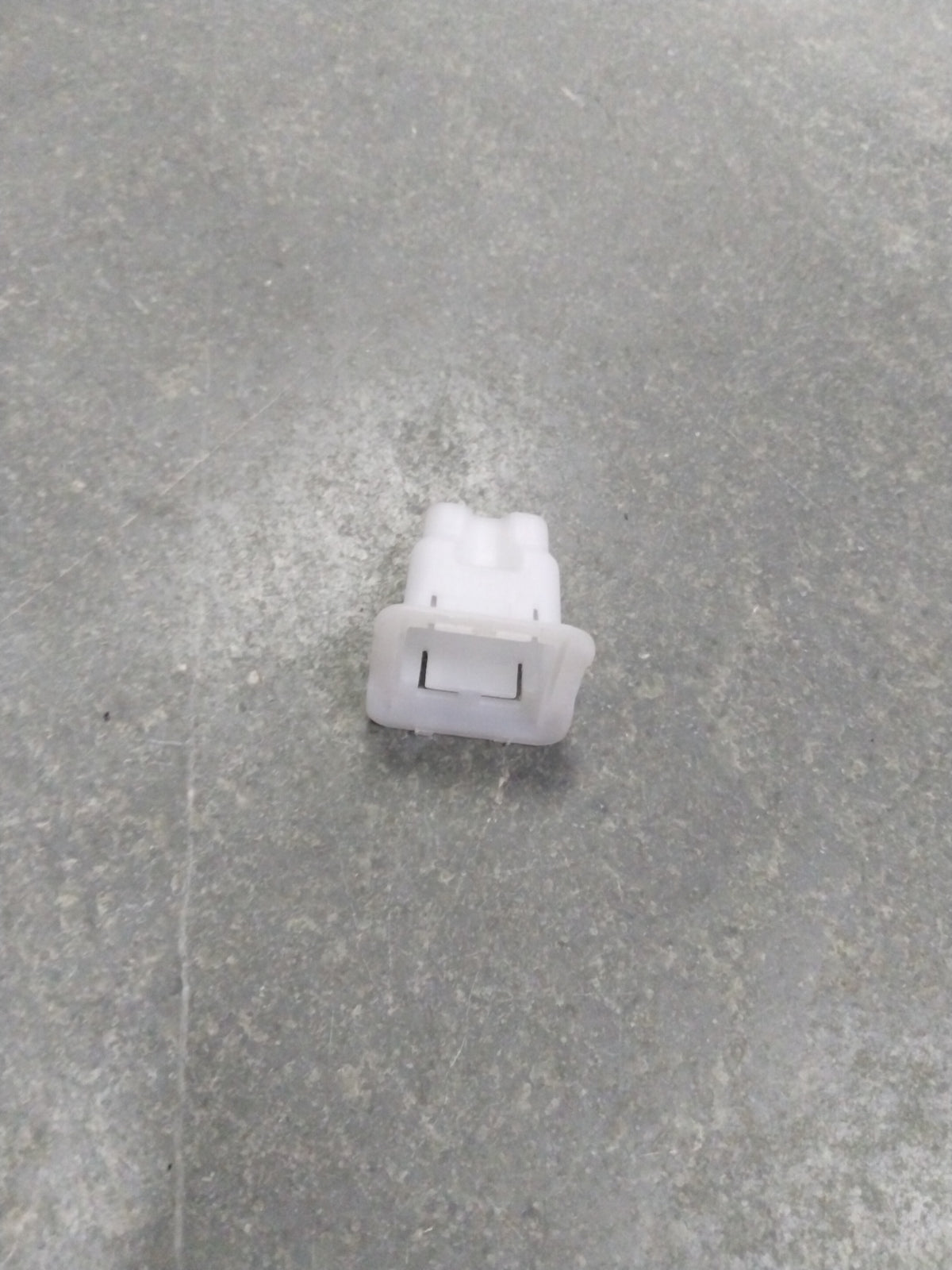 Suzuki A-Star rear cushion seat hook, spare part from CarTrends, shown attached to the vehicle's interior seat area.
