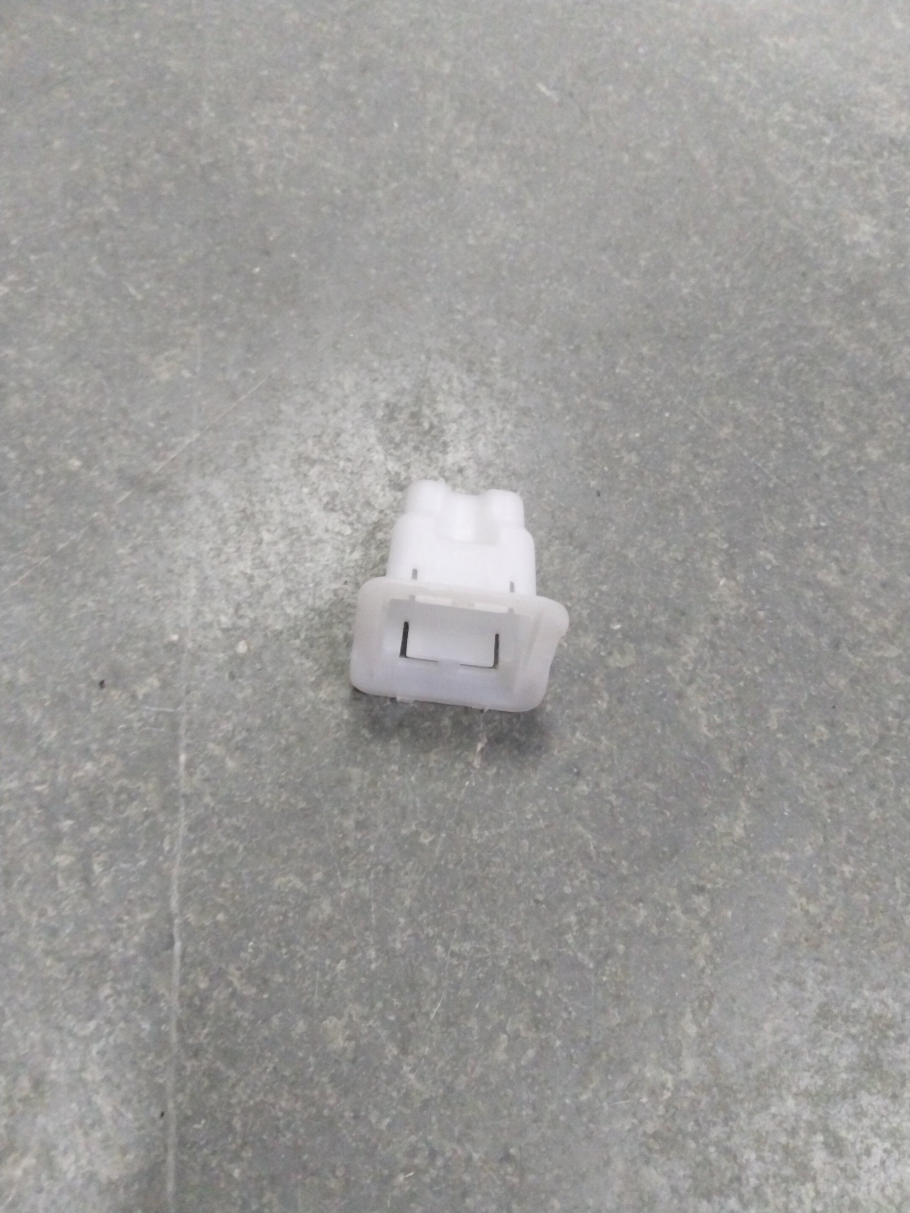 Suzuki A-Star rear cushion seat hook, spare part from CarTrends, shown attached to the vehicle's interior seat area.