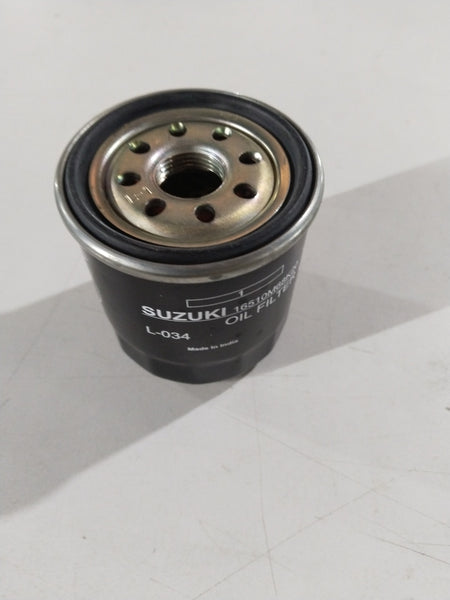Suzuki oil filter spare part by CarTrends, model #16510M68K20, detailed close-up of the cylindrical filter component.