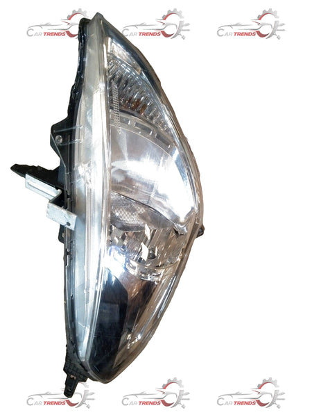 Nissan Sunny headlamp assembly showing the vehicle's front headlight and reflective components on a white background.