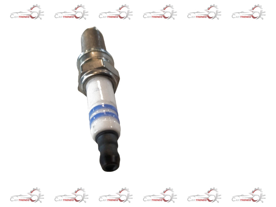 CarTrends spark plug for Tata Nexon petrol engine, showing the metal and ceramic components of the automotive ignition part.