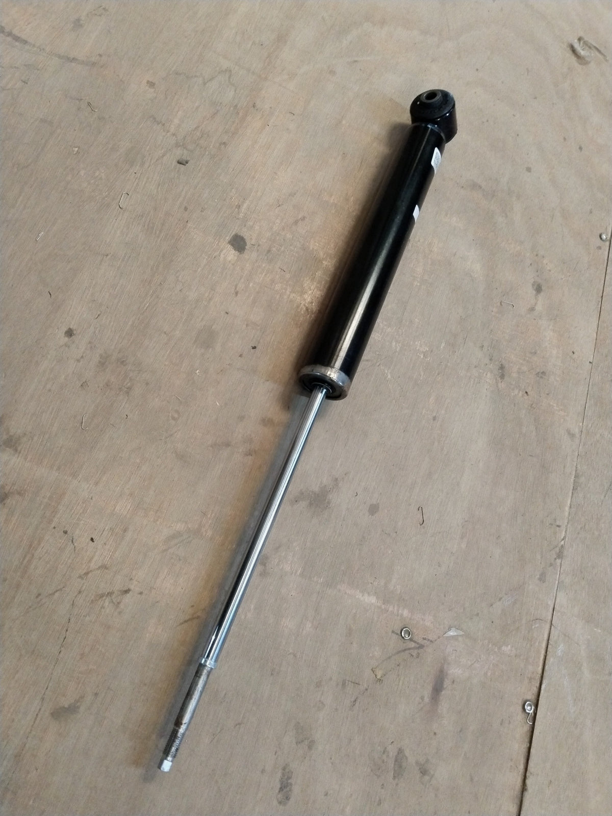 Hyundai Creta or Alcazar rear shocker, automotive suspension component with part number 55307BV000, installed on vehicle.