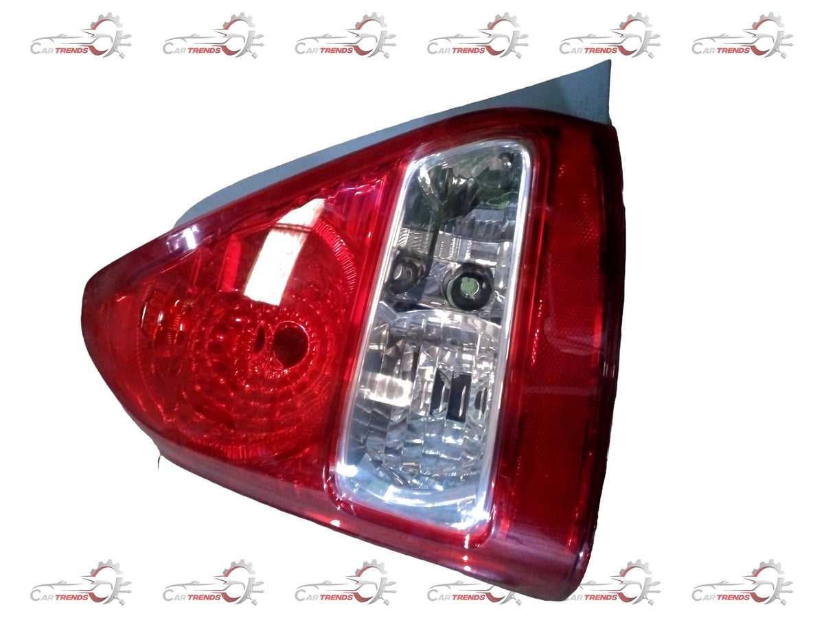 Toyota Yaris rear lens combination assembly, showing the clear lens and mounting hardware for vehicle rear signal or brake light.