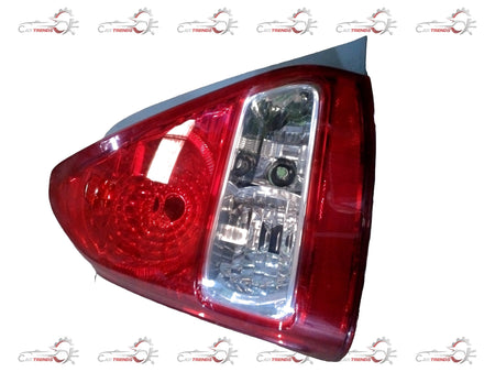Toyota Yaris rear lens combination assembly, showing the clear lens and mounting hardware for vehicle rear signal or brake light.