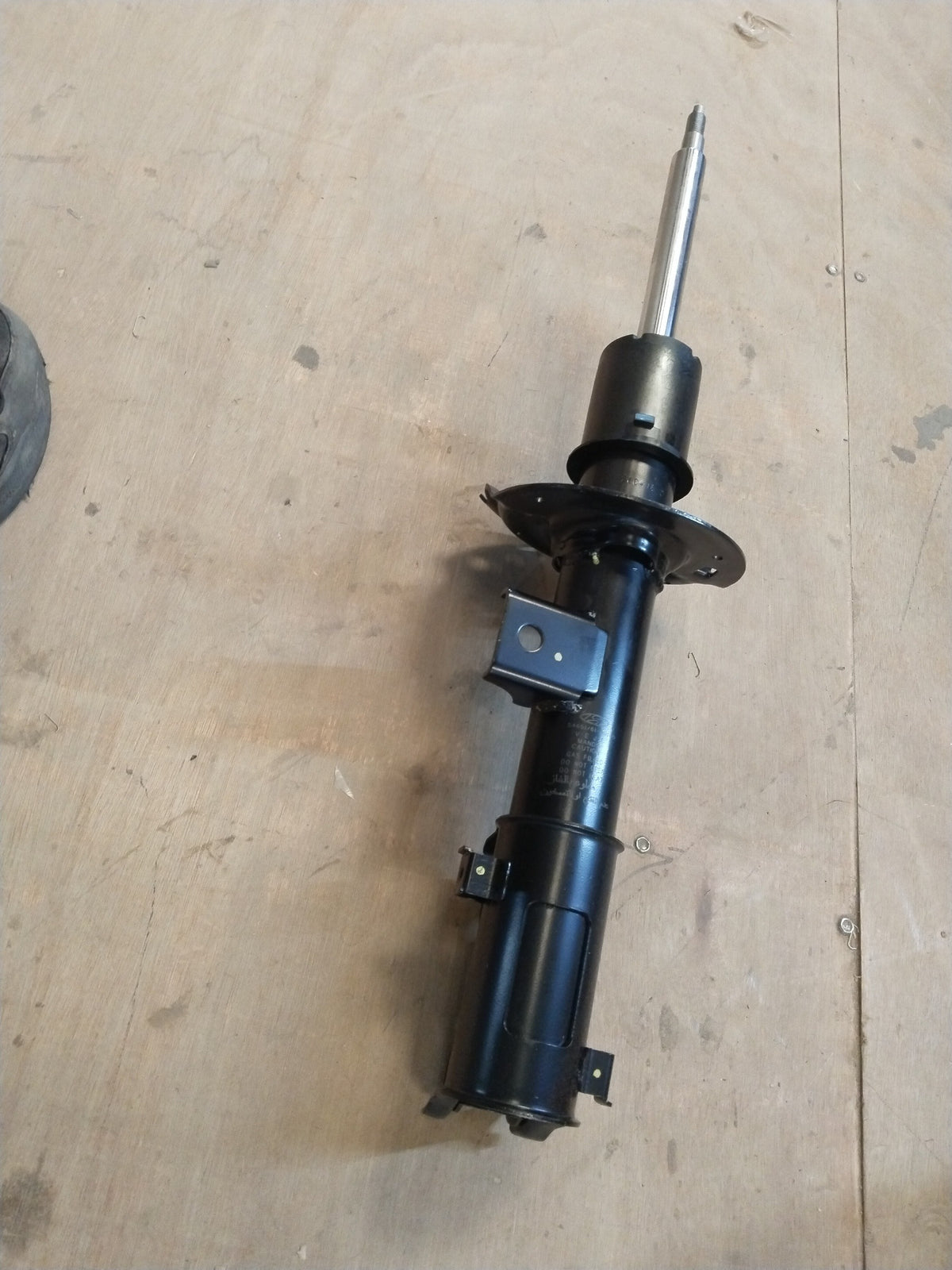 Hyundai Creta front left shock absorber, part #54651A0100, showing the black metal shock component with mounting points.
