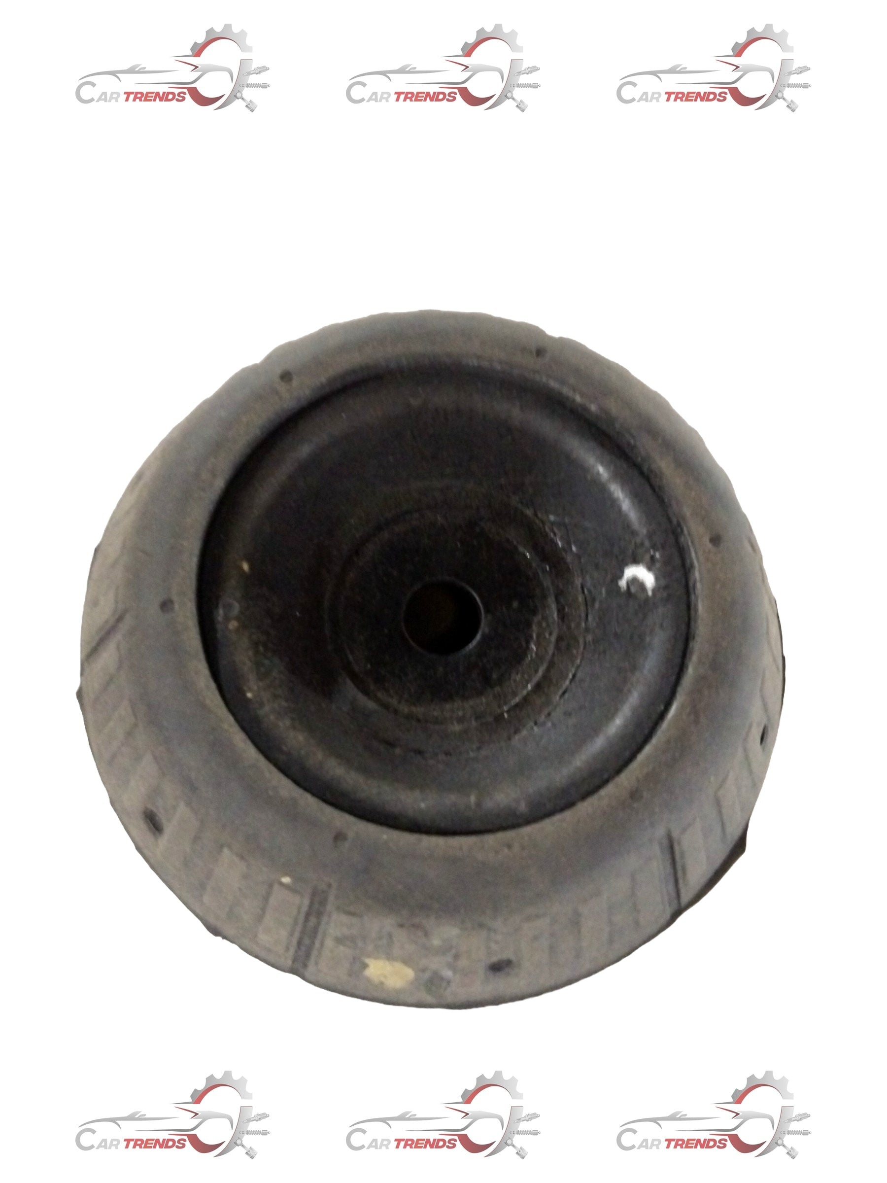 Maruti Suzuki Shocker Mount Ritz car part in black, showing close-up of mounting bracket for vehicle shock absorption.