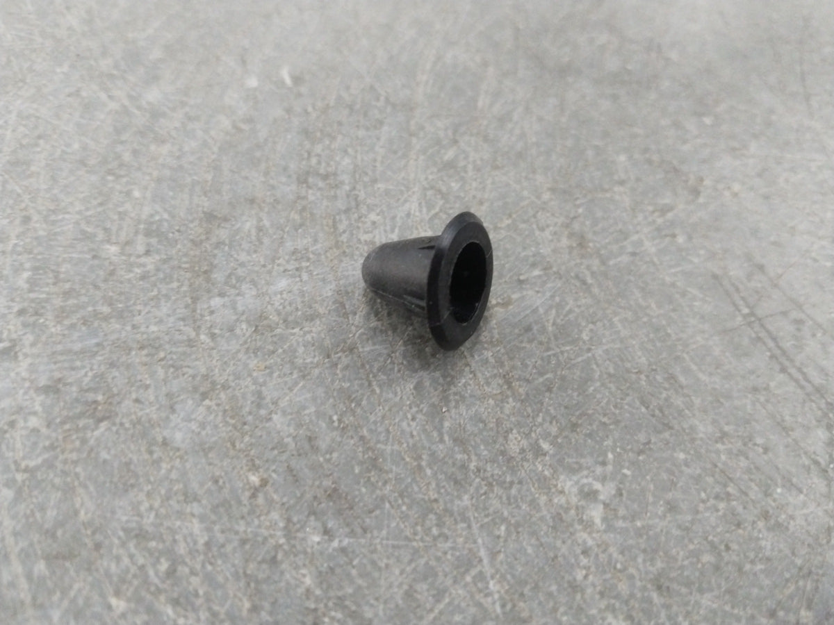 Chevrolet Aveo spare part from General Motors, close-up of the clip showing its shape and material for vehicle repair.