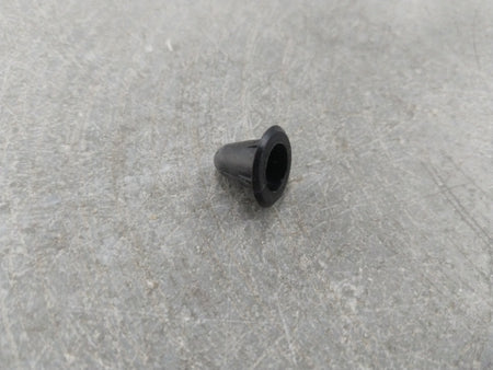 Chevrolet Aveo spare part from General Motors, close-up of the clip showing its shape and material for vehicle repair.