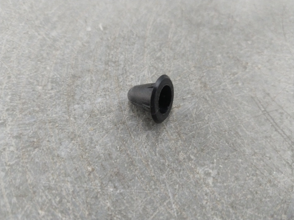 Chevrolet Aveo spare part from General Motors, close-up of the clip showing its shape and material for vehicle repair.