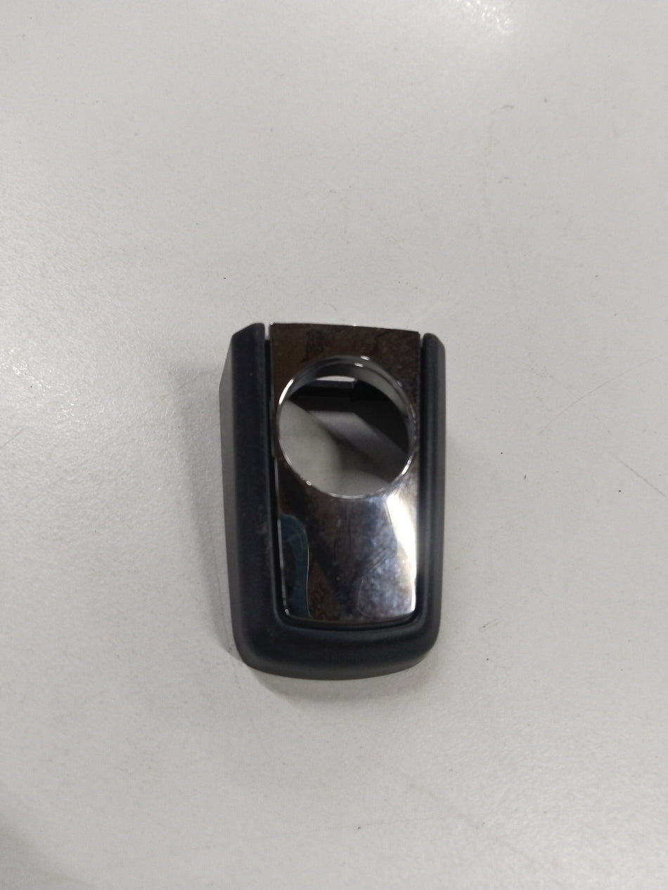 General Motors Chevrolet Cruze side door lock opening cover, part number 10552, showing the black plastic component and latch area.