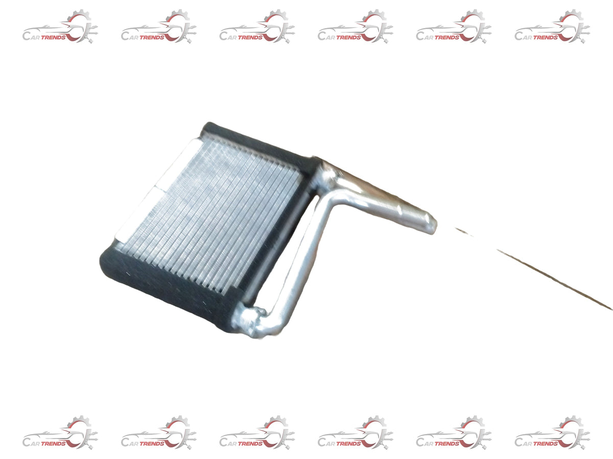 Maruti Suzuki CORE HEATER 74120M79G00 installed in a vehicle, showing the compact heater unit with wiring connections.