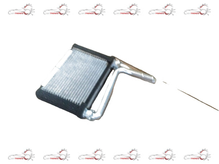 Maruti Suzuki CORE HEATER 74120M79G00 installed in a vehicle, showing the compact heater unit with wiring connections.