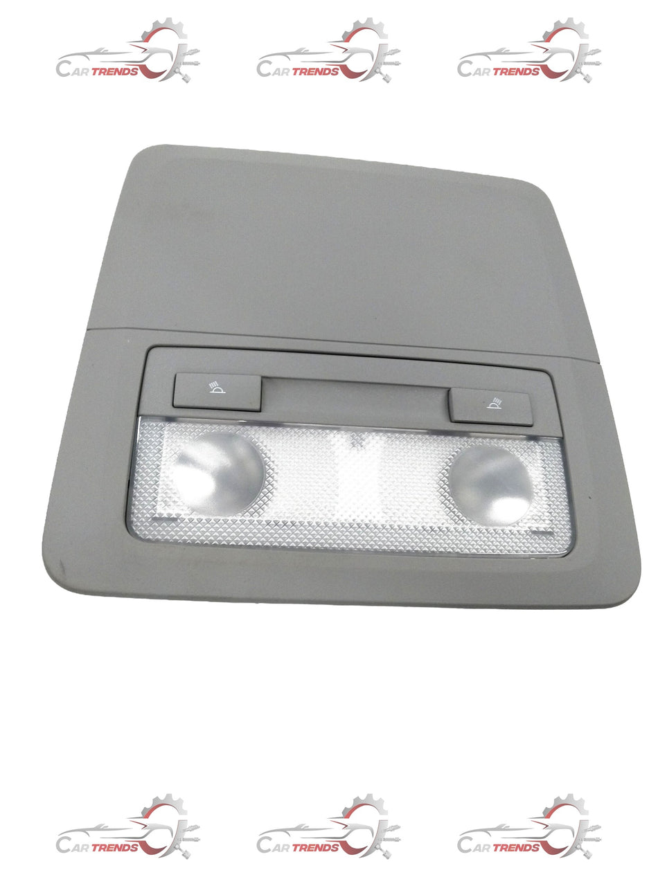 Chevrolet Cruze bezel dome lamp by General Motors, showing the clear plastic cover and mounting hardware for interior lighting replacement.