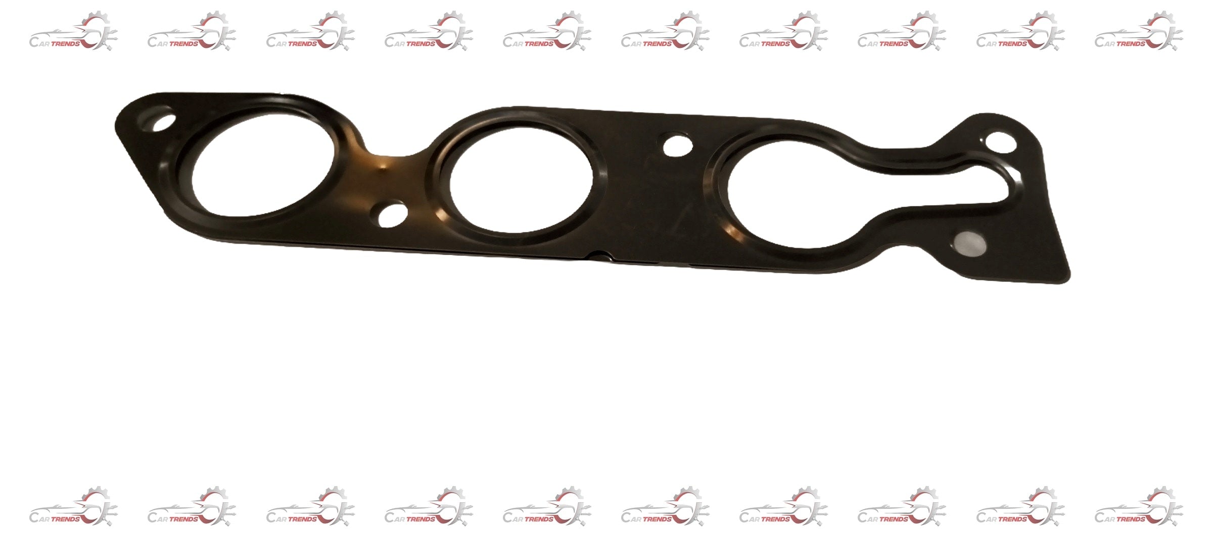Maruti Suzuki A-Star exhaust gasket by CarTrends, close-up view showing rubber and metal components for engine sealing.