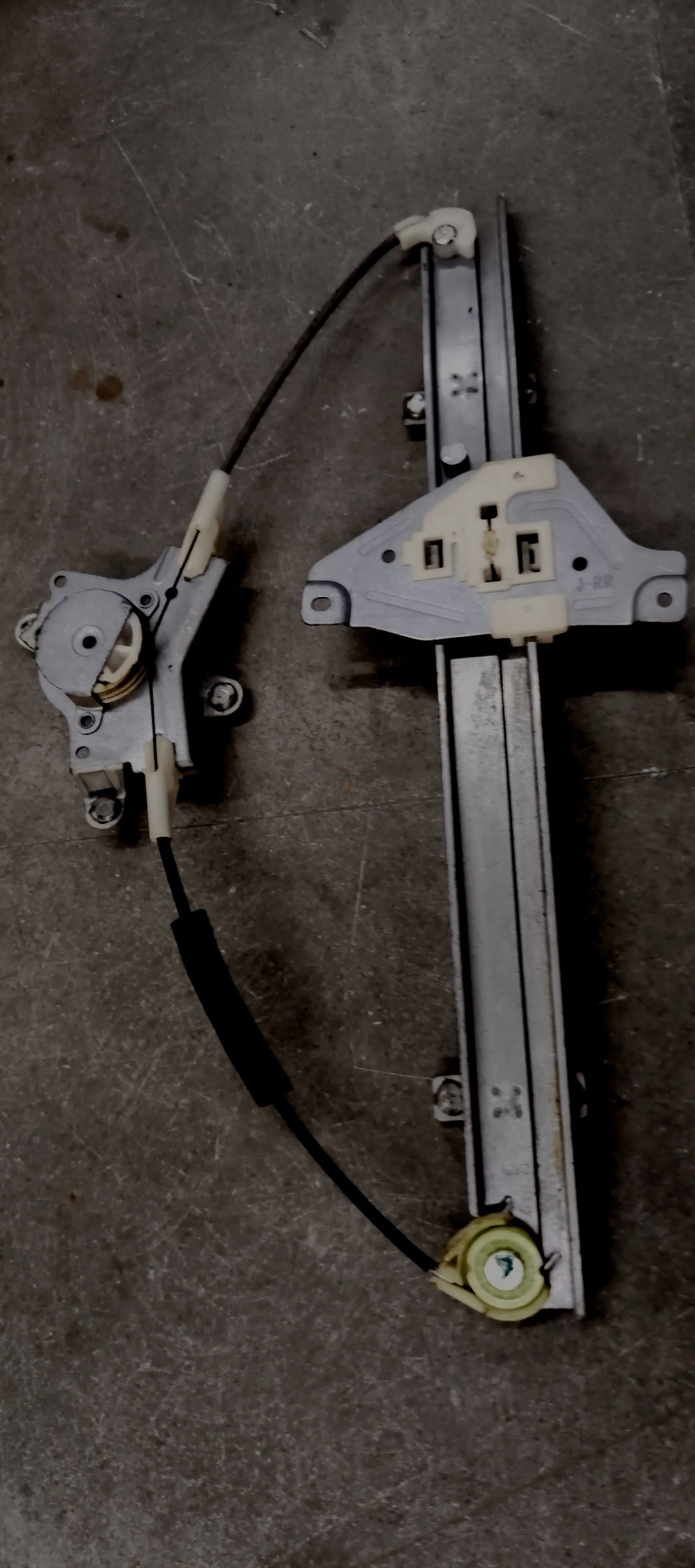 CarTrends Chevrolet Aveo rear right electric window regulator spare part showing the regulator mechanism installed in the door.