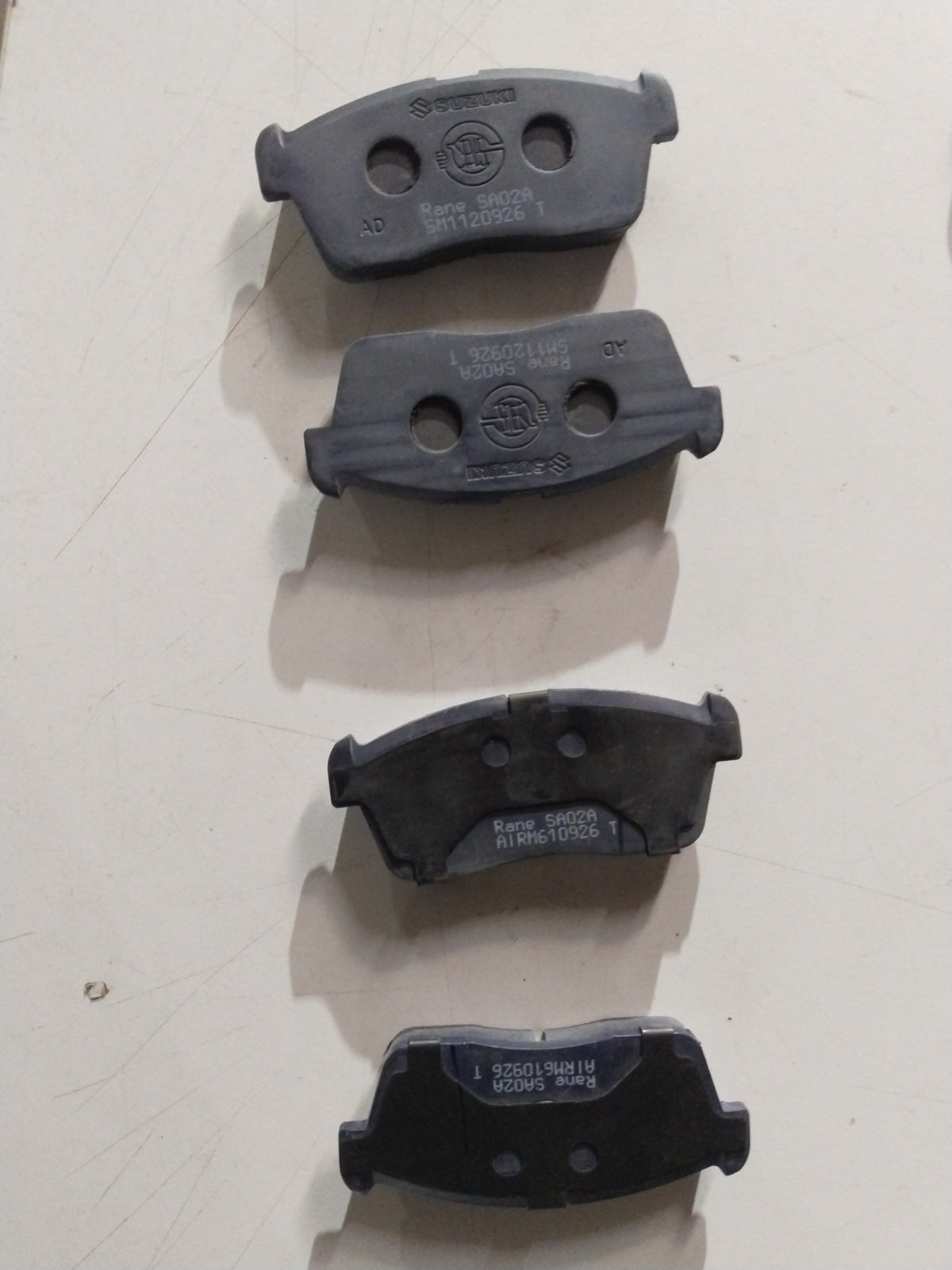 Front brake pad for Maruti Suzuki Eeco and Versa, all variants, showing the metal and friction surface of the brake component.