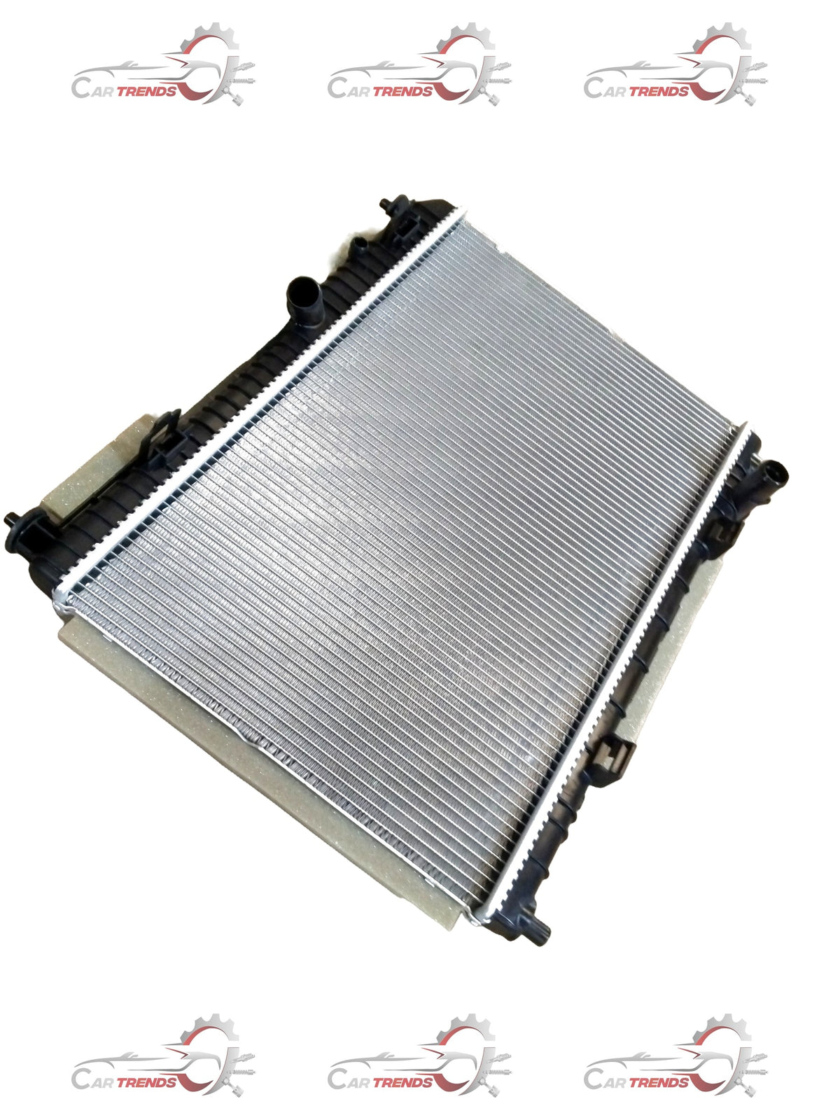 Ford radiator by CarTrends, with metal fins and cooling tanks, designed for efficient engine cooling in vehicles.