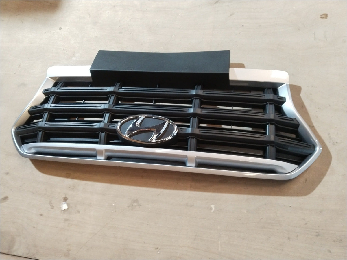 Hyundai Creta and Alcazar radiator grille from CarTrends, spare parts, with a black mesh design and chrome accents.