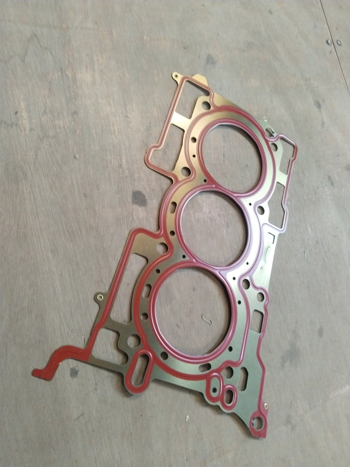 CarTrends Ford cylinder head gasket GN1Z6051B shown with close-up view of gasket material and engine sealing surface.