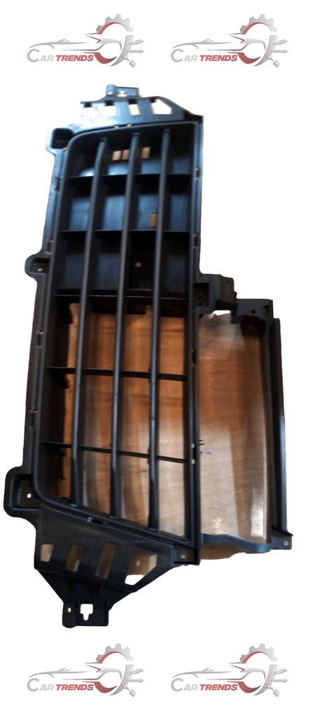 Maruti Suzuki Wagon R radiator grille showing chrome accents and mounting points for engine cooling and front design.