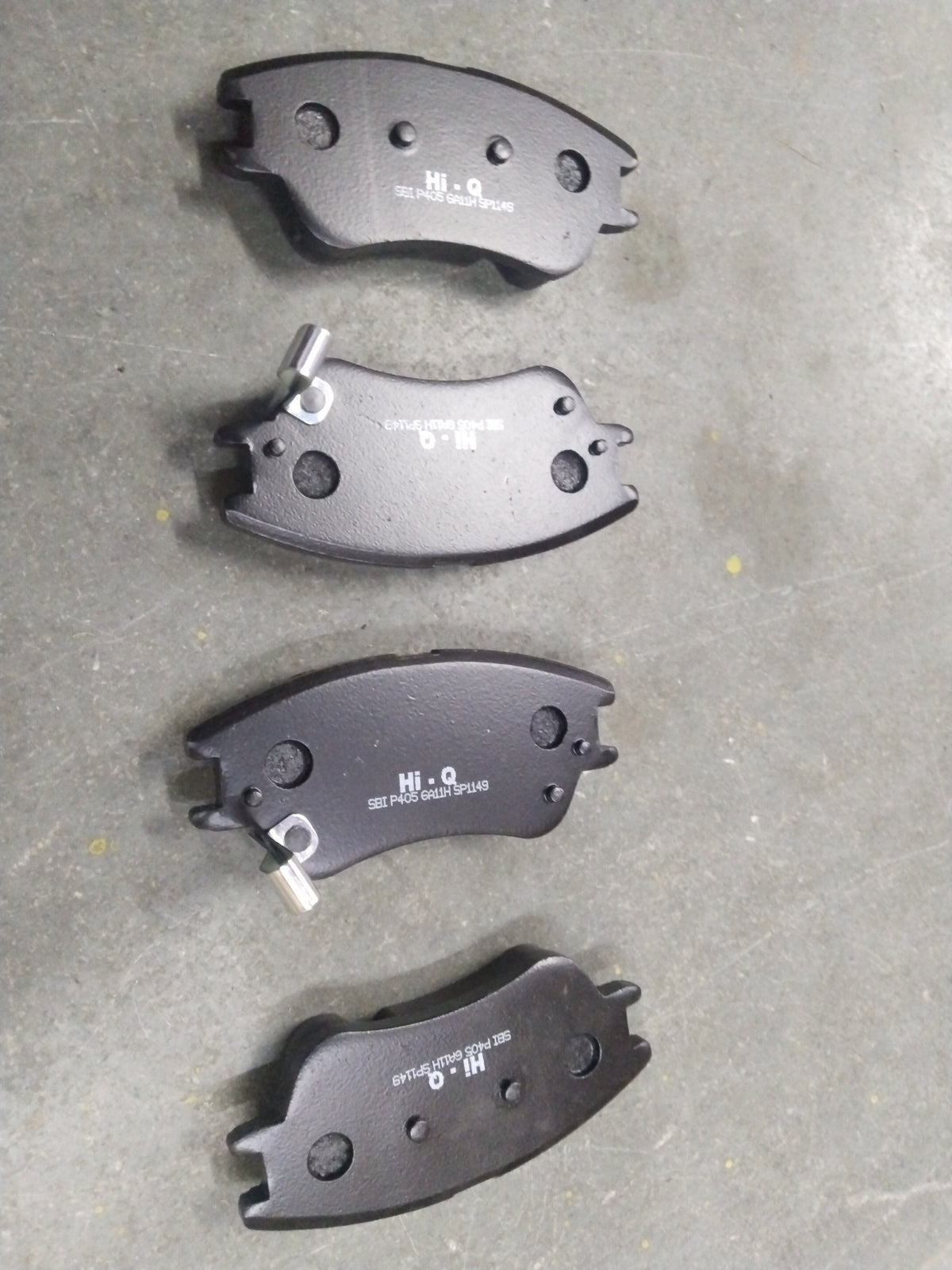 Front HI-Q brake pad for Hyundai Santro Xing, part number SP1149, showing the new, durable brake pad with metal backing plate.