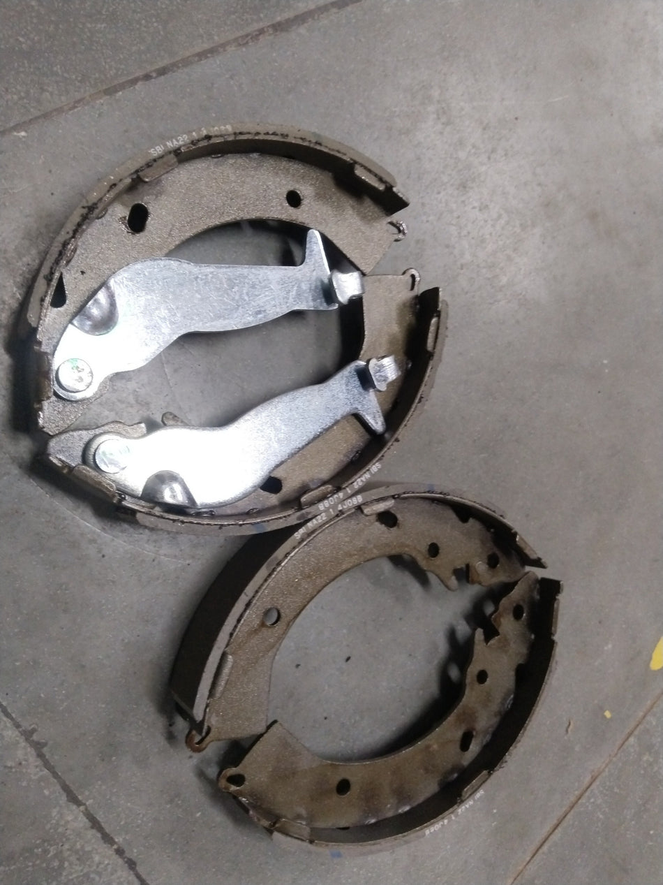Rear brake shoe for Hyundai Santro Xing by CarTrends, showing the metal brake shoe with friction lining for vehicle braking system.