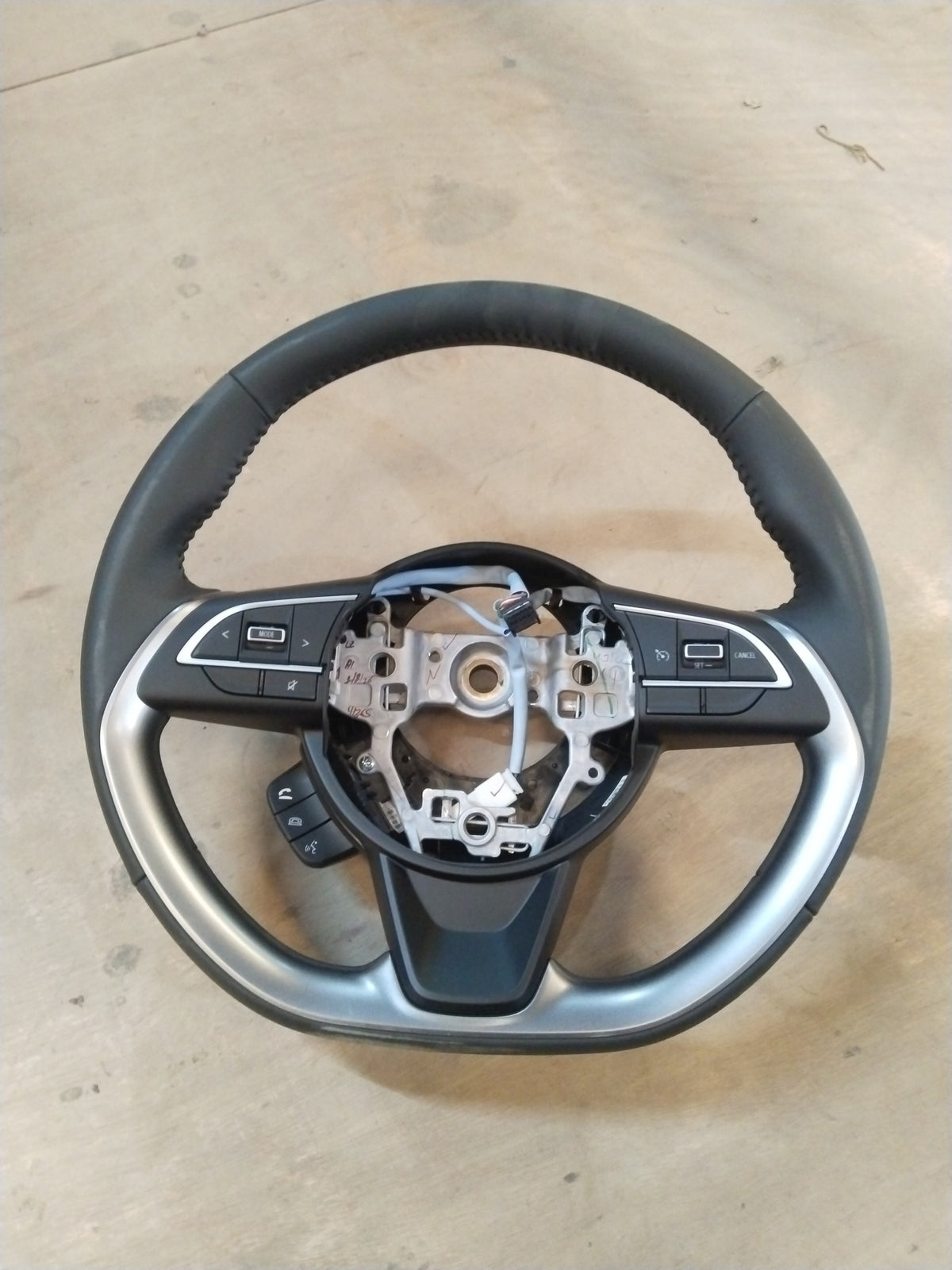 Maruti Suzuki Brezza 2nd Gen steering wheel for petrol and CNG models, featuring a black and silver finish and ergonomic design.